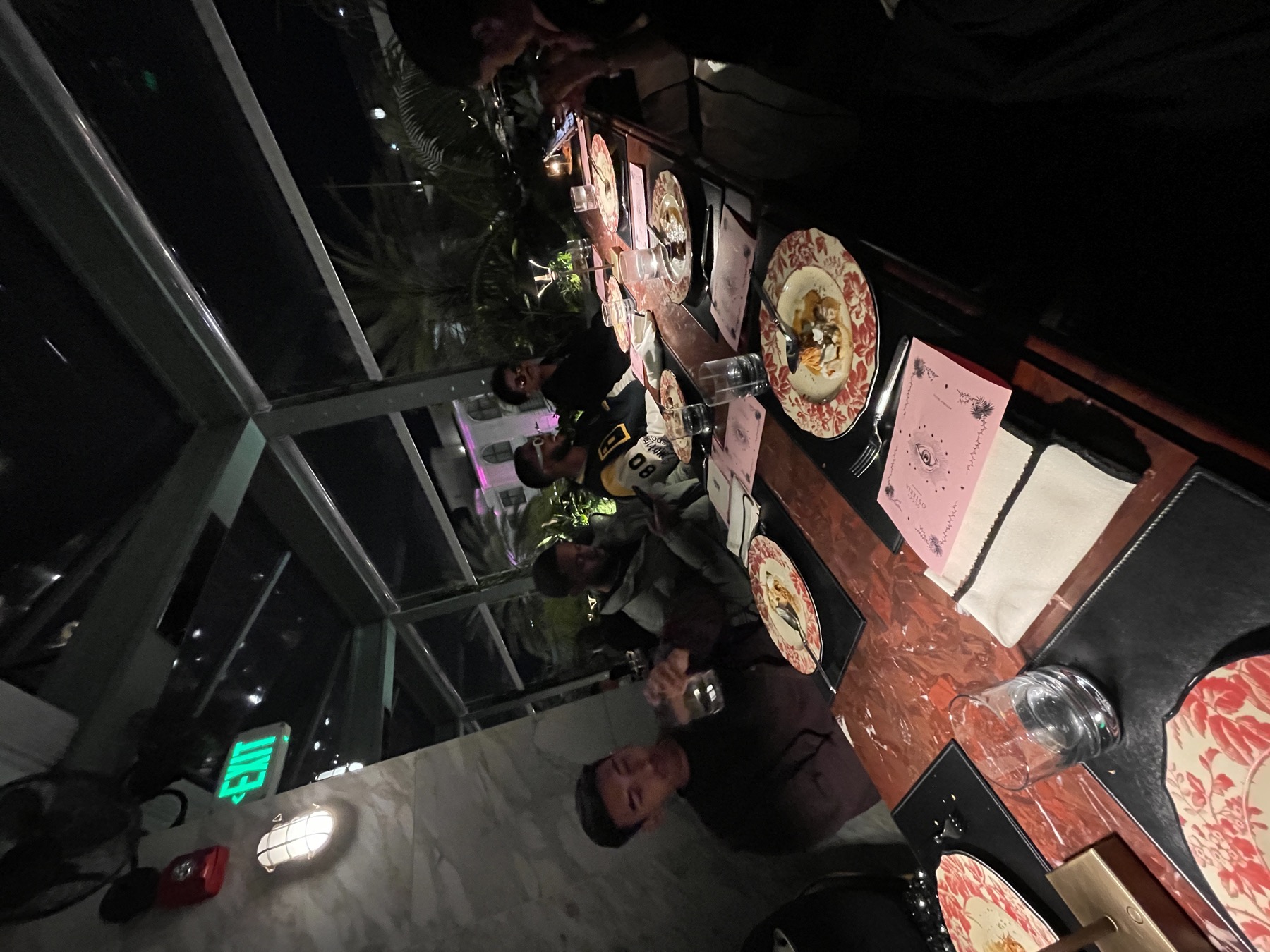 Restaurant table and dinner plates at night