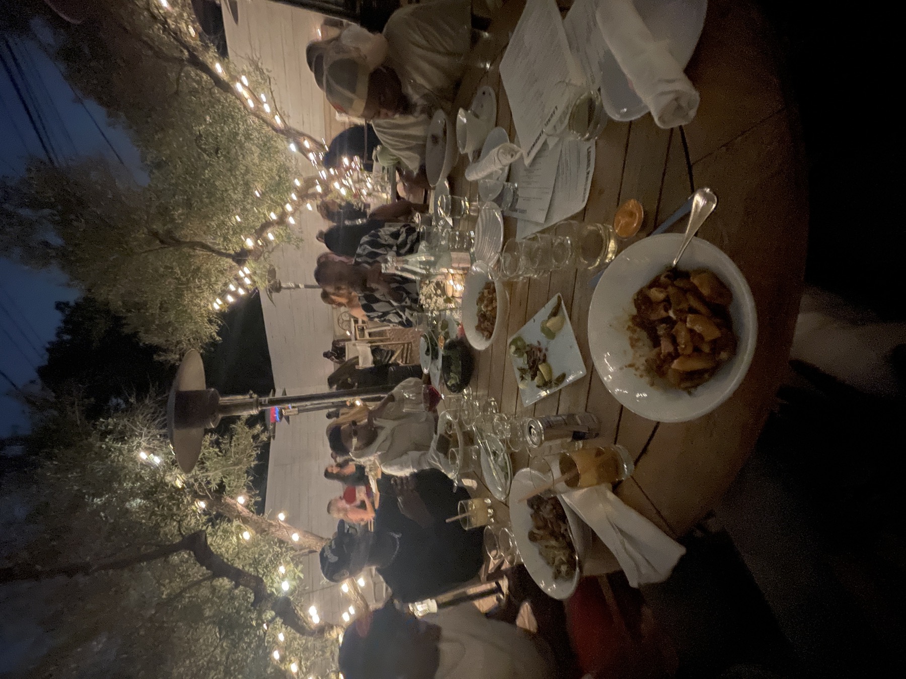 Outdoor dining experience with warm lights