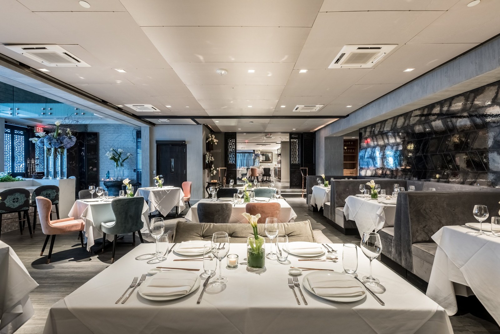 Crustacean Beverly Hills dining room with white tablecloths and soft lighting